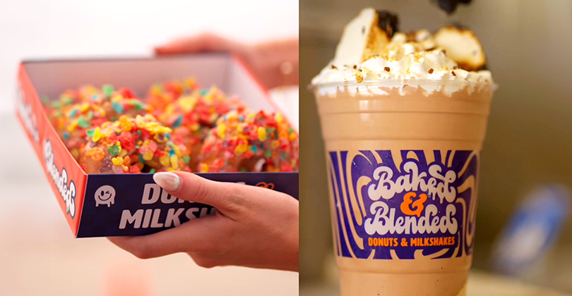 a hand holding a box of doughnuts and a cup of coffee