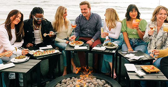 a group of people eating and drinking