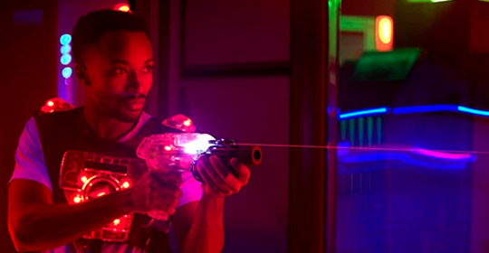 a man holding a toy gun