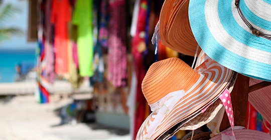 a group of hats on a rack