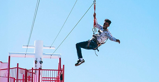 a man in a zip line