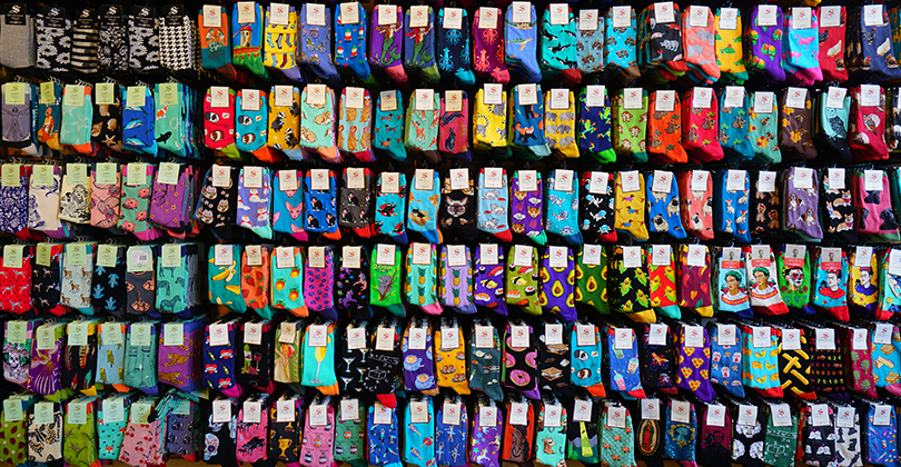 a wall of socks with different designs