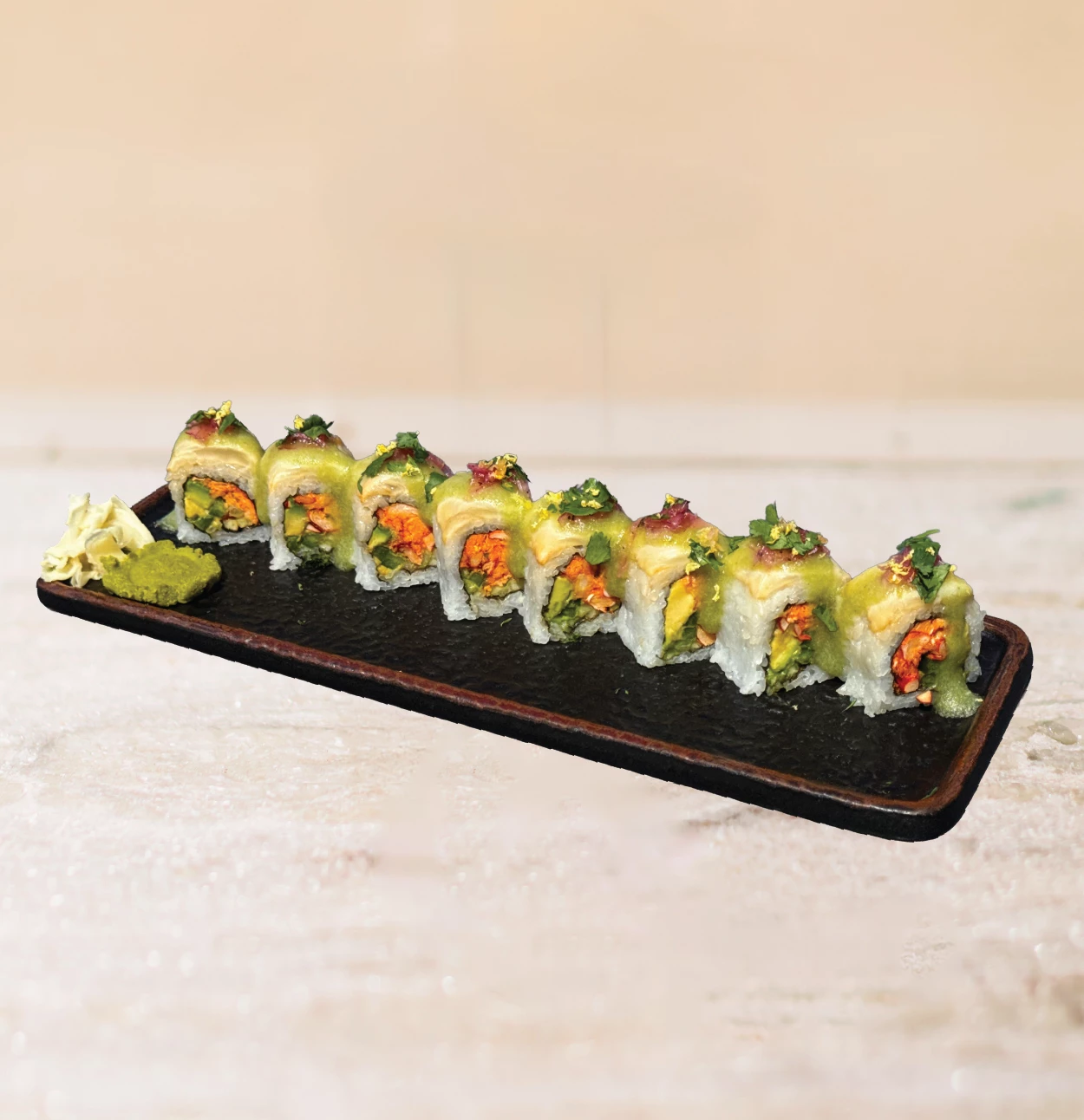 a plate of sushi on a table, specifically the Big Papa Roll