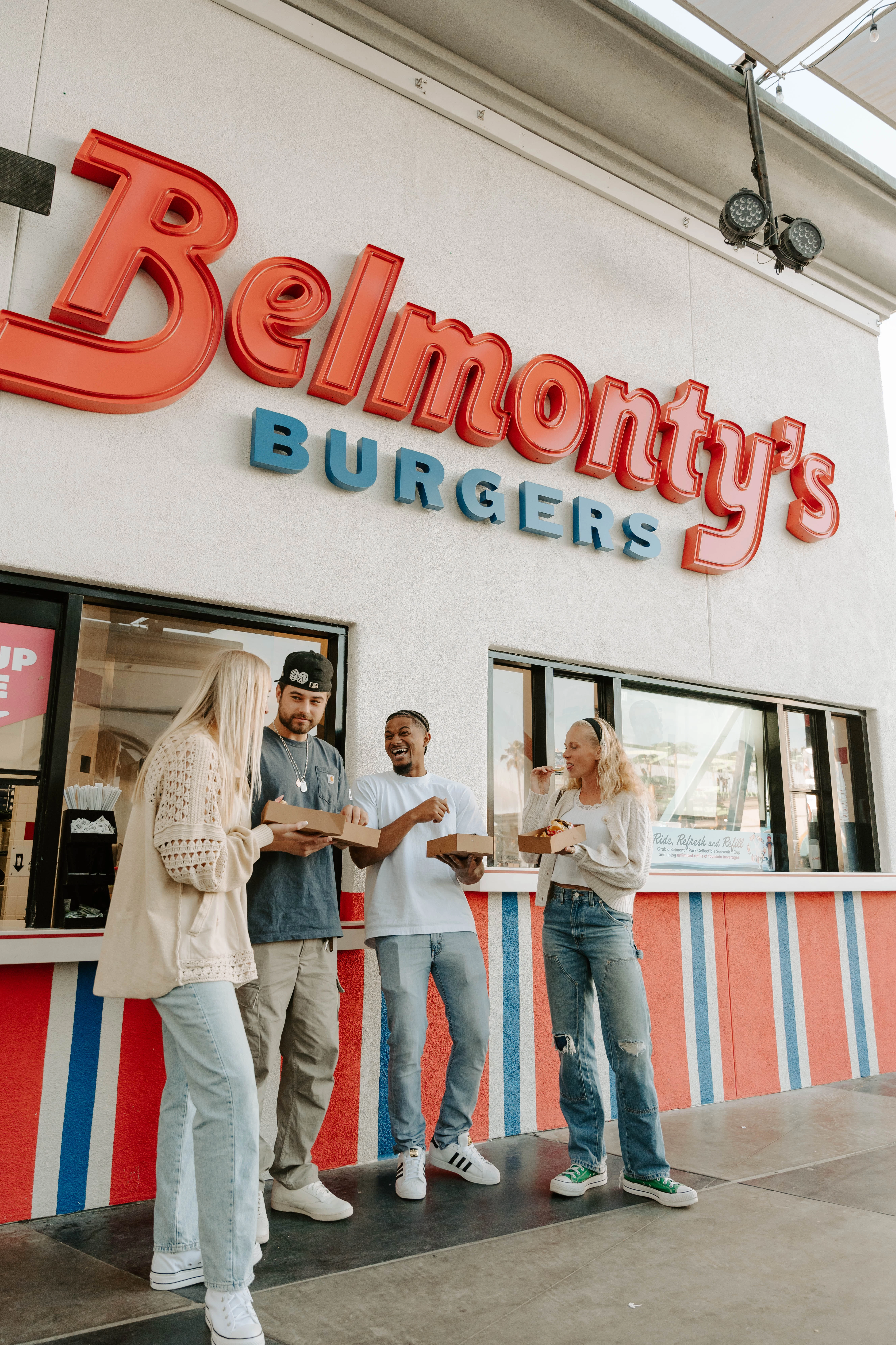 a group of people standing outside a restaurant