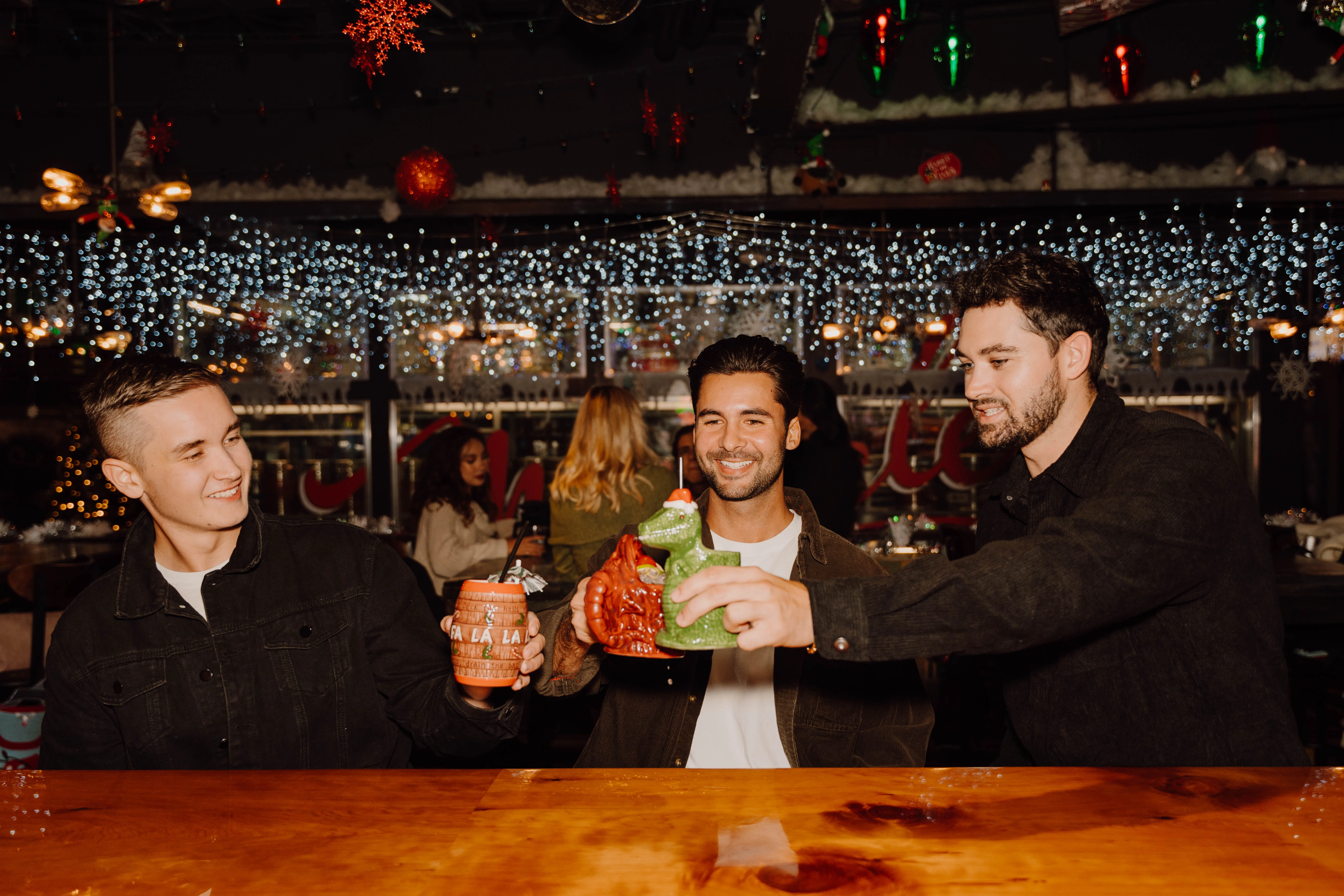 a group of people holding cups