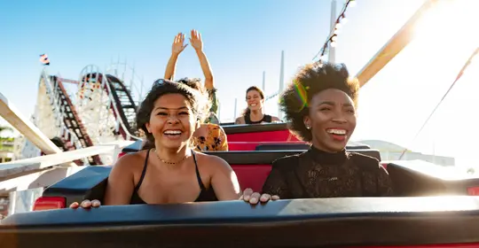 a group of women on a roller coaster