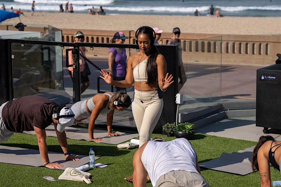 a group of people doing yoga on a deck