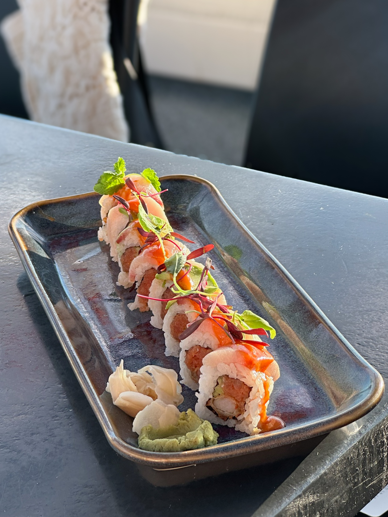 a plate of sushi on a table
