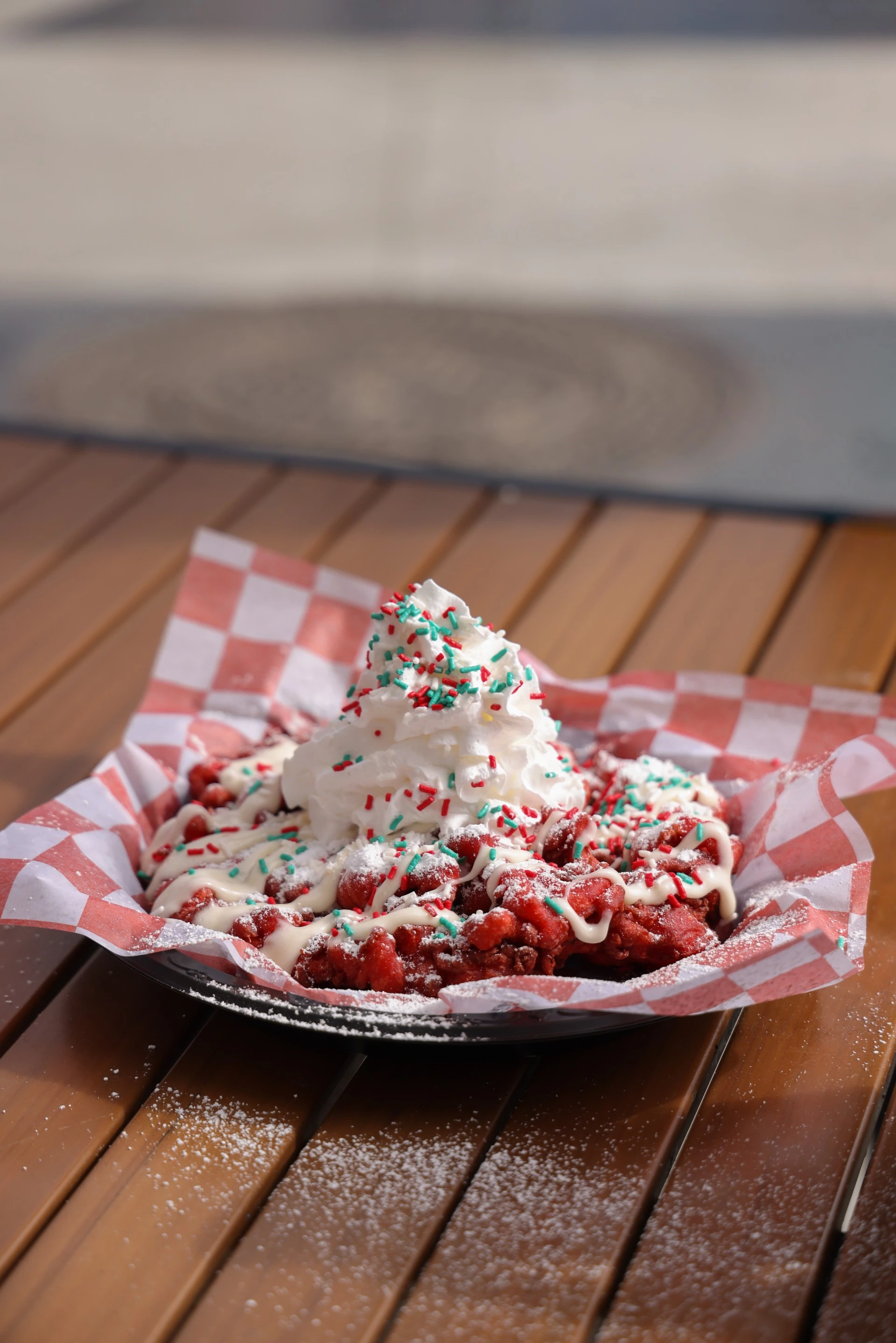 a plate of food with whipped cream and sprinkles