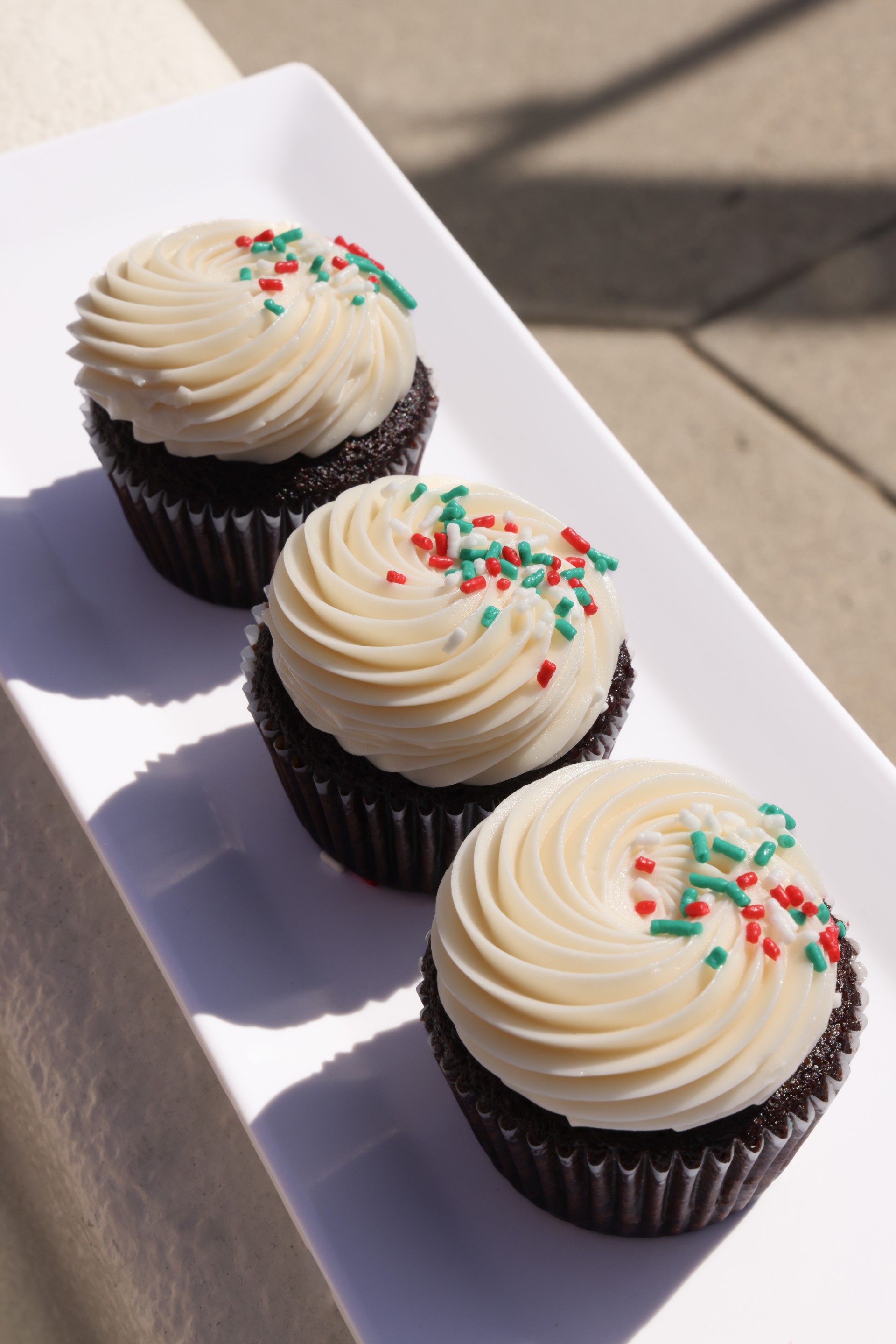 a group of cupcakes with frosting on top