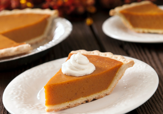 a slice of pumpkin pie on a plate