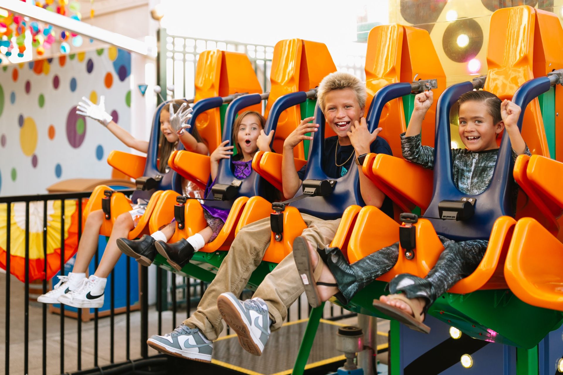 a group of kids on a roller coaster
