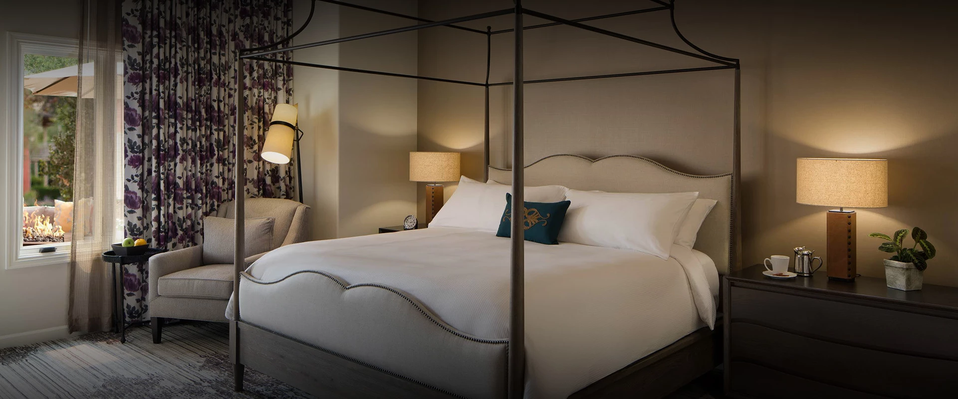 a bed with a four poster bed