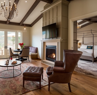 a room with a fireplace and a bed