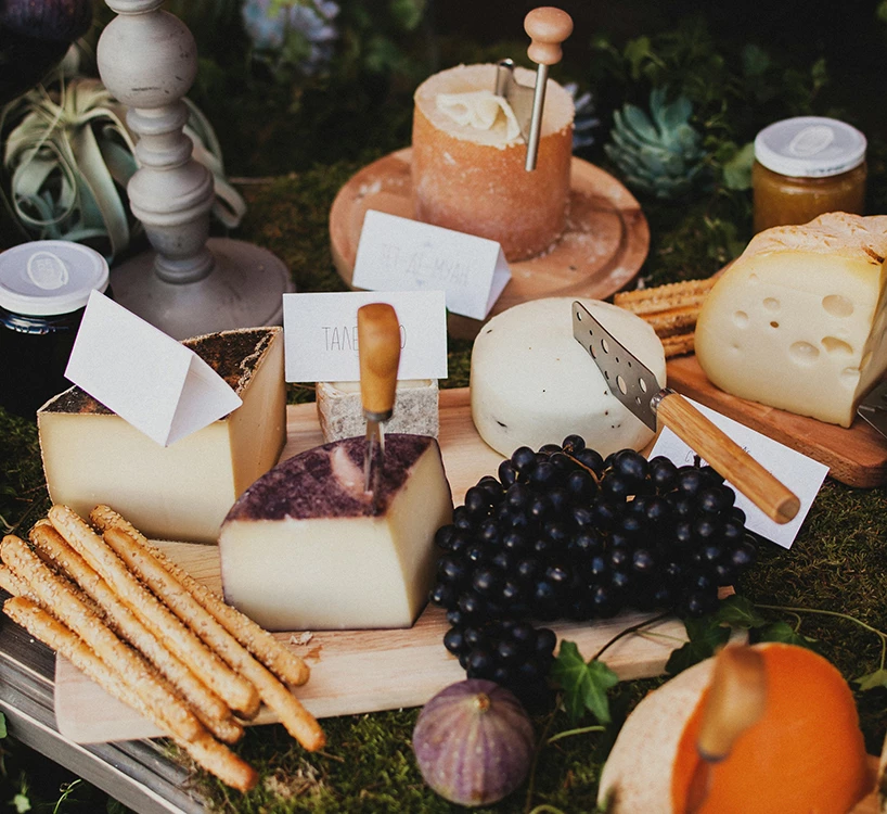 a tray of cheese and bread sticks