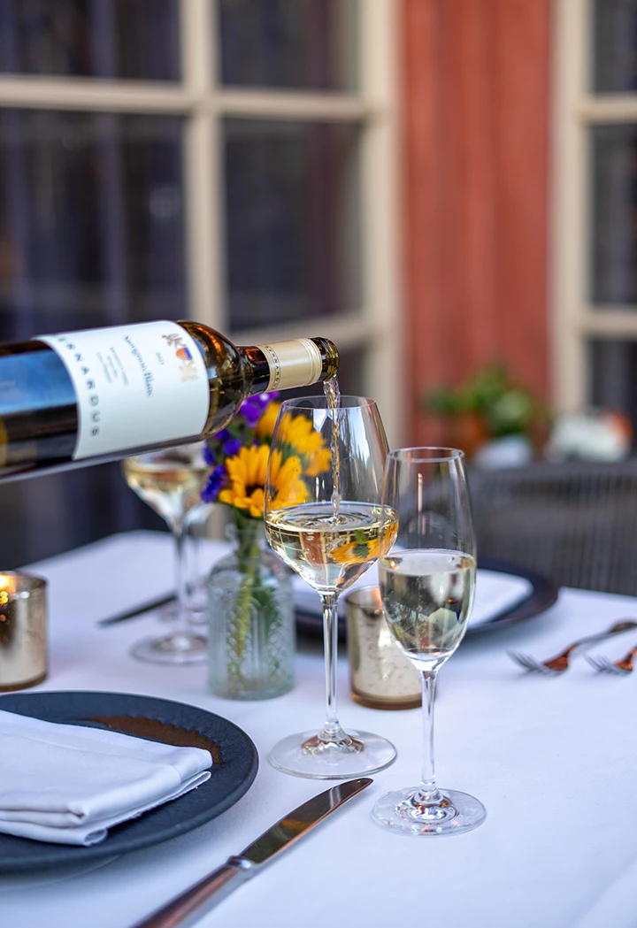 a wine being poured into a glass