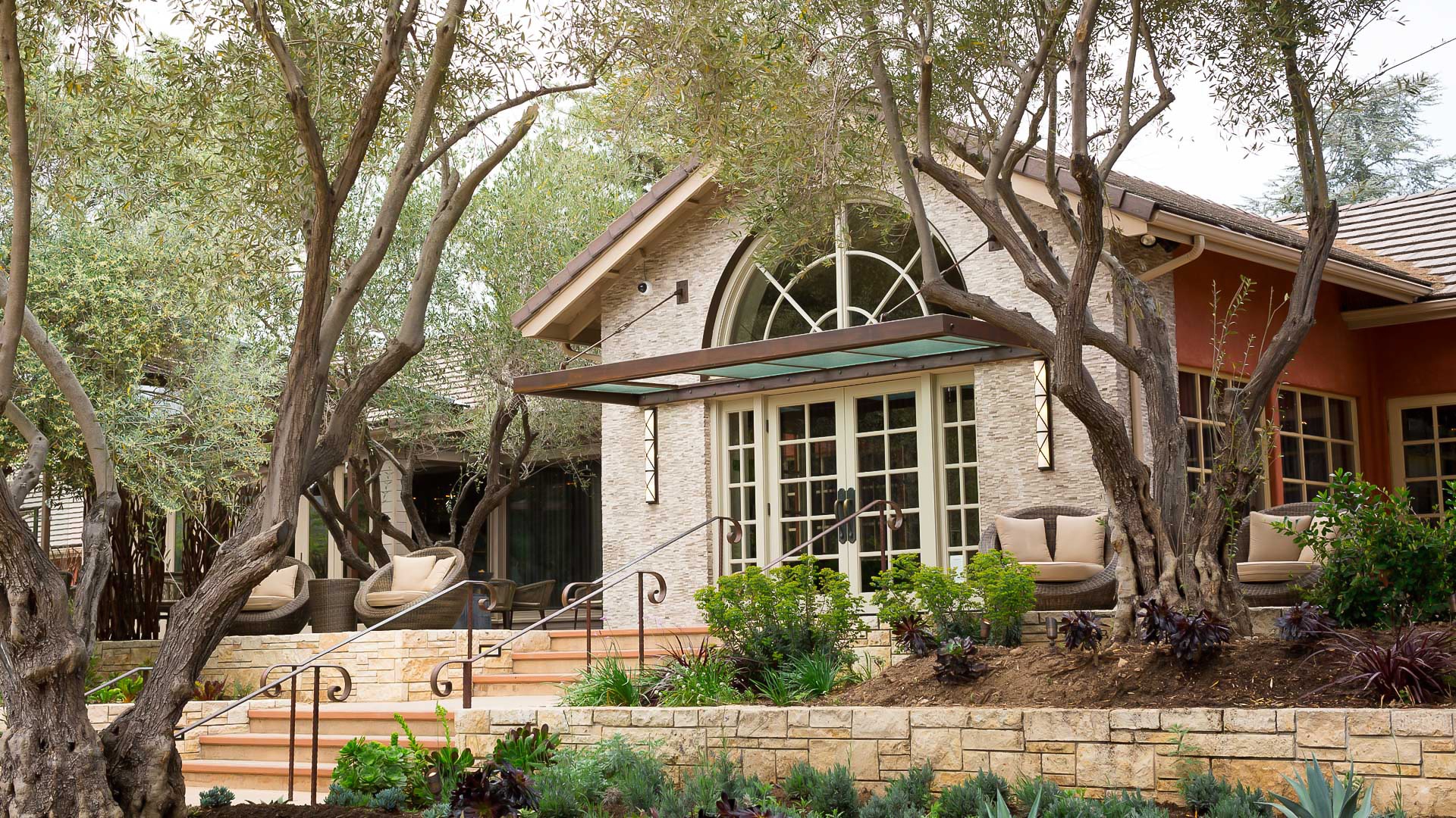 a house with a garden and stairs