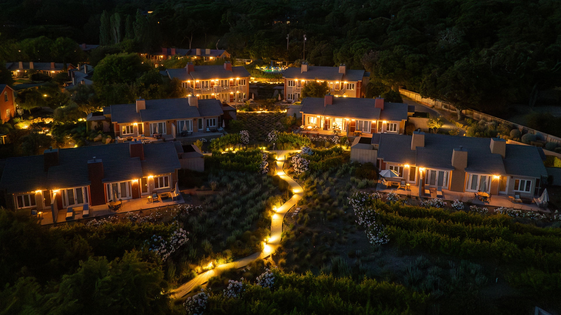 a group of houses with lights on