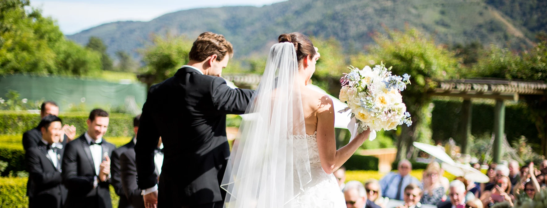 a man in a suit and a woman in a white dress