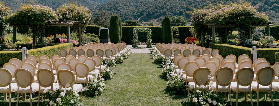 chairs in a garden with flowers