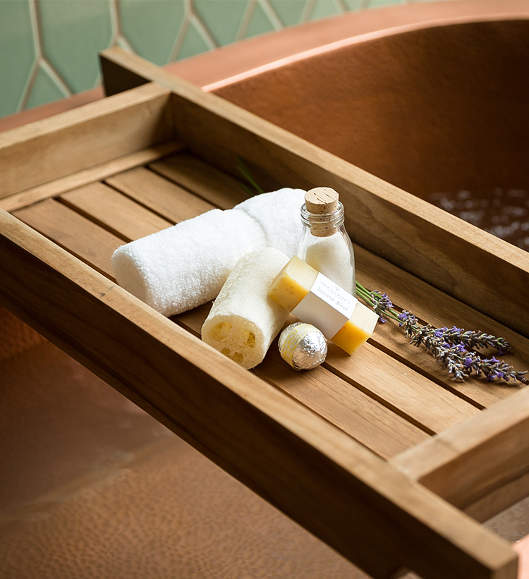 a bath salt and soap on a wooden tray