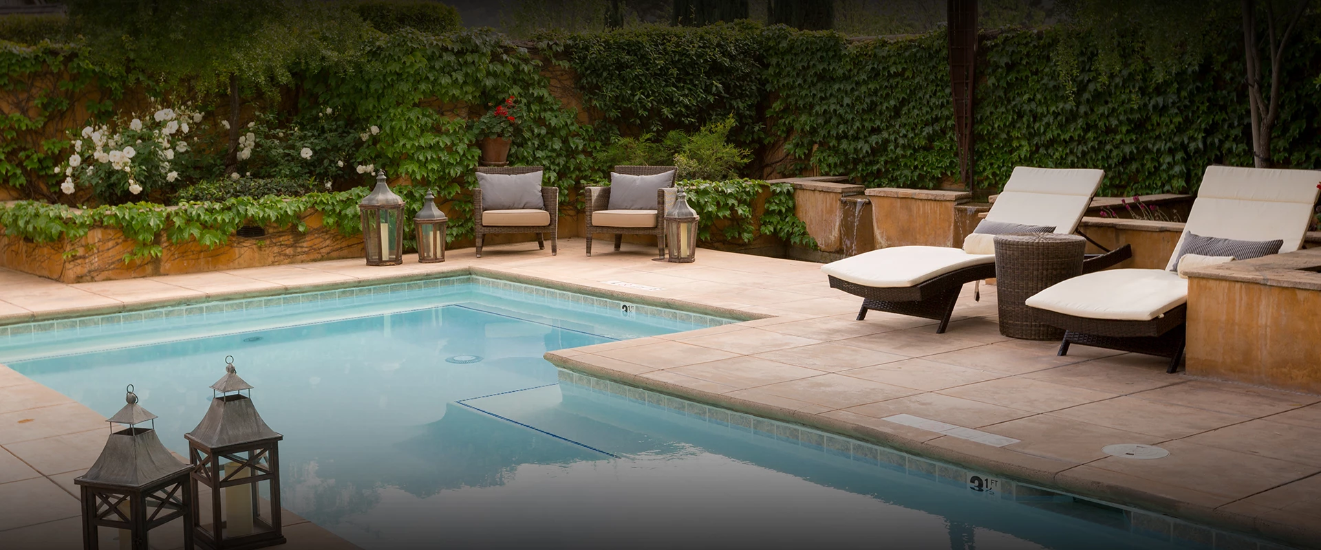 a pool with chairs and a pool