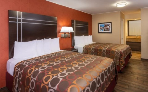 interior of hotel room with two queen beds 