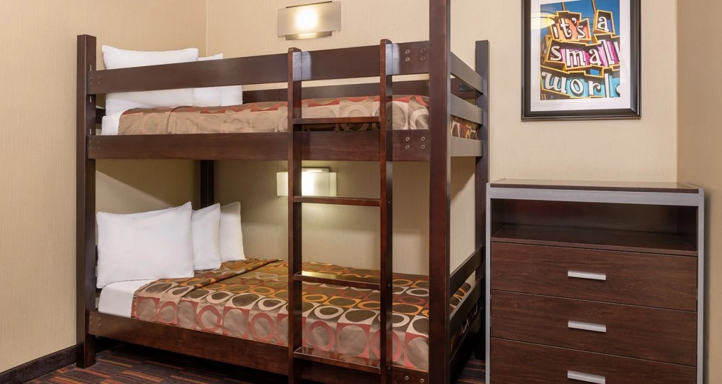 small room with brown bunk bed