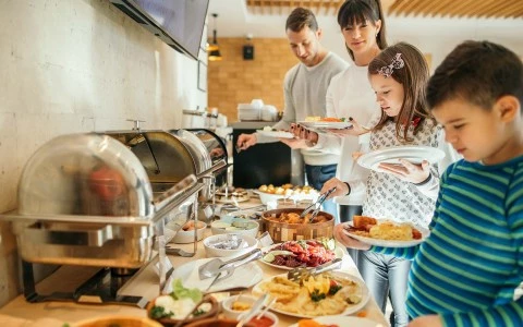 family in line to get breakfast