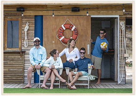 a group of people sitting on chairs outside a building