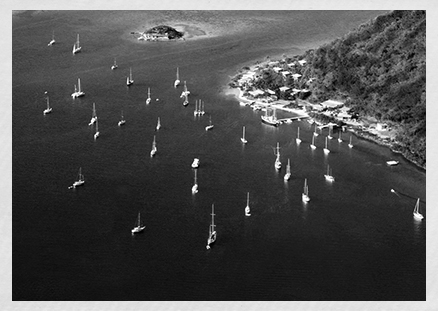 a group of sailboats in the water