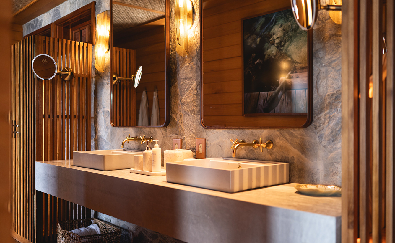 a bathroom with two sinks and mirrors