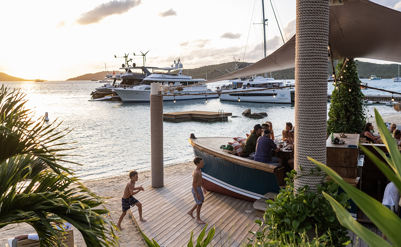 a group of people on a dock near a body of water
