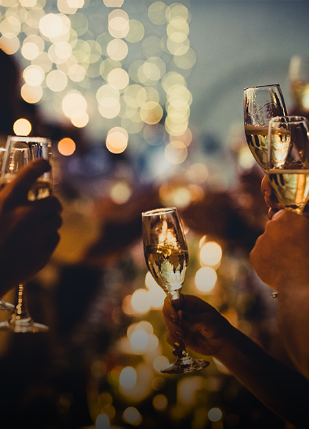 a group of people holding wine glasses