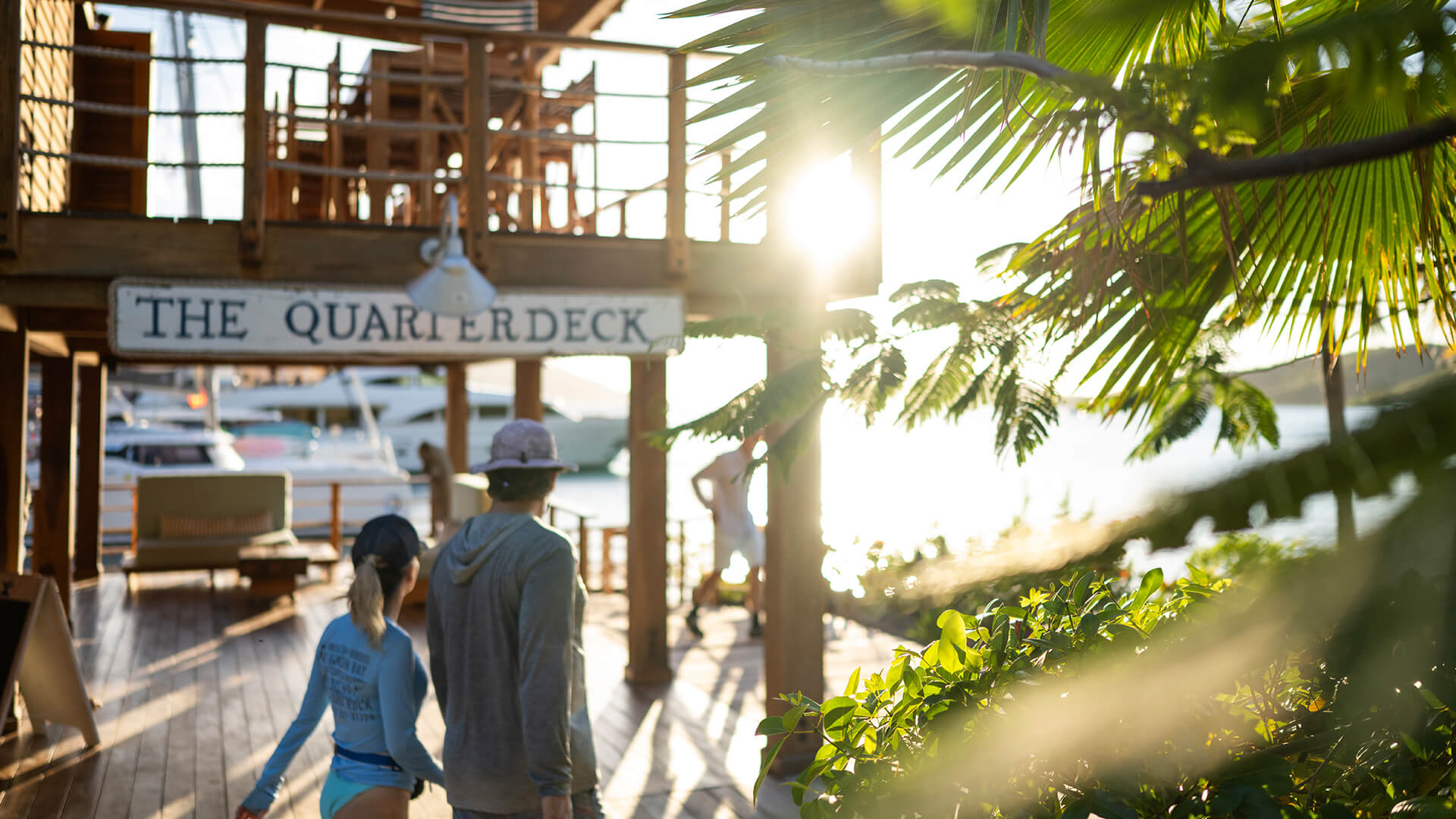 a group of people walking on a dock