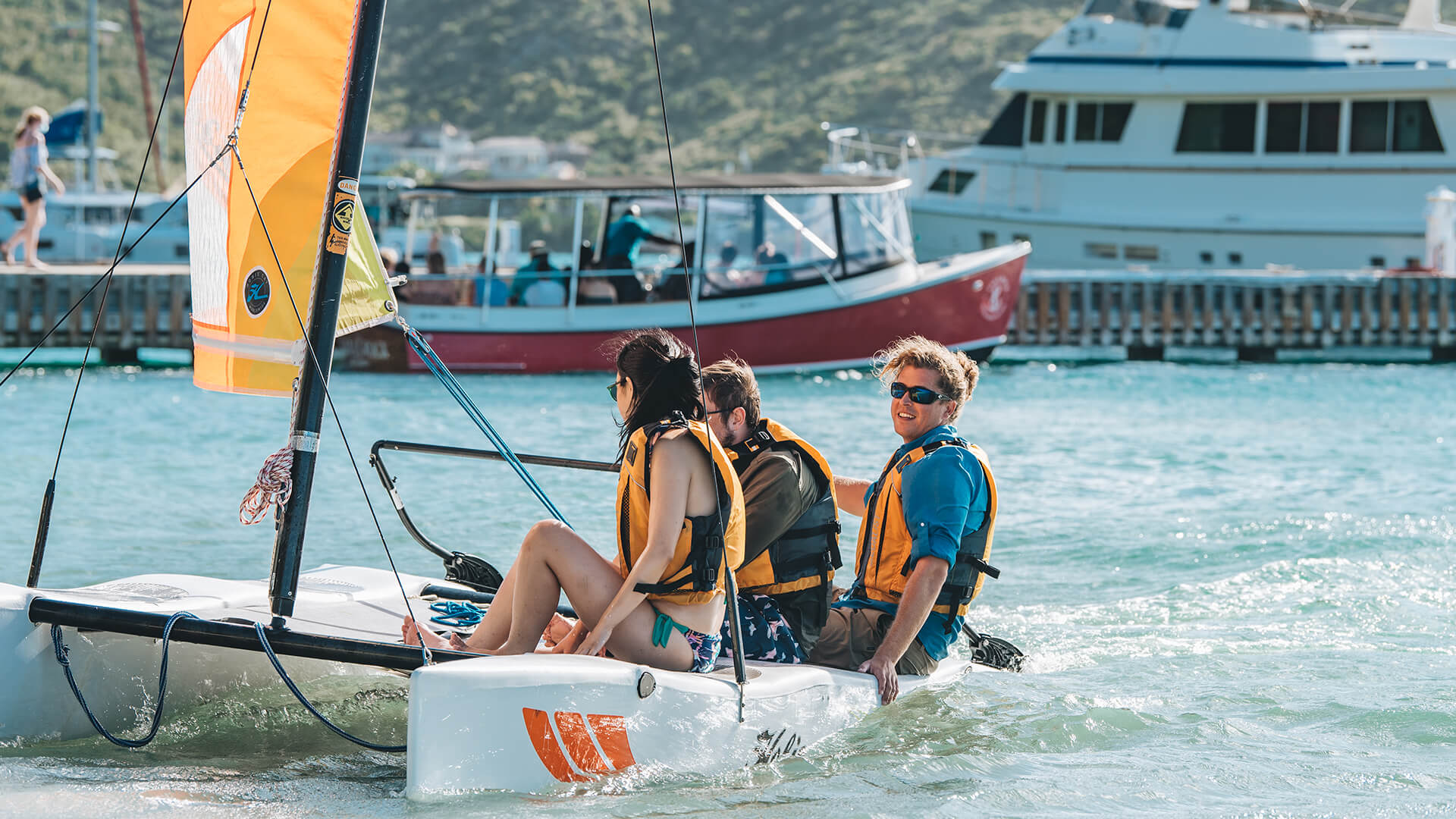 a group of people on a sailboat