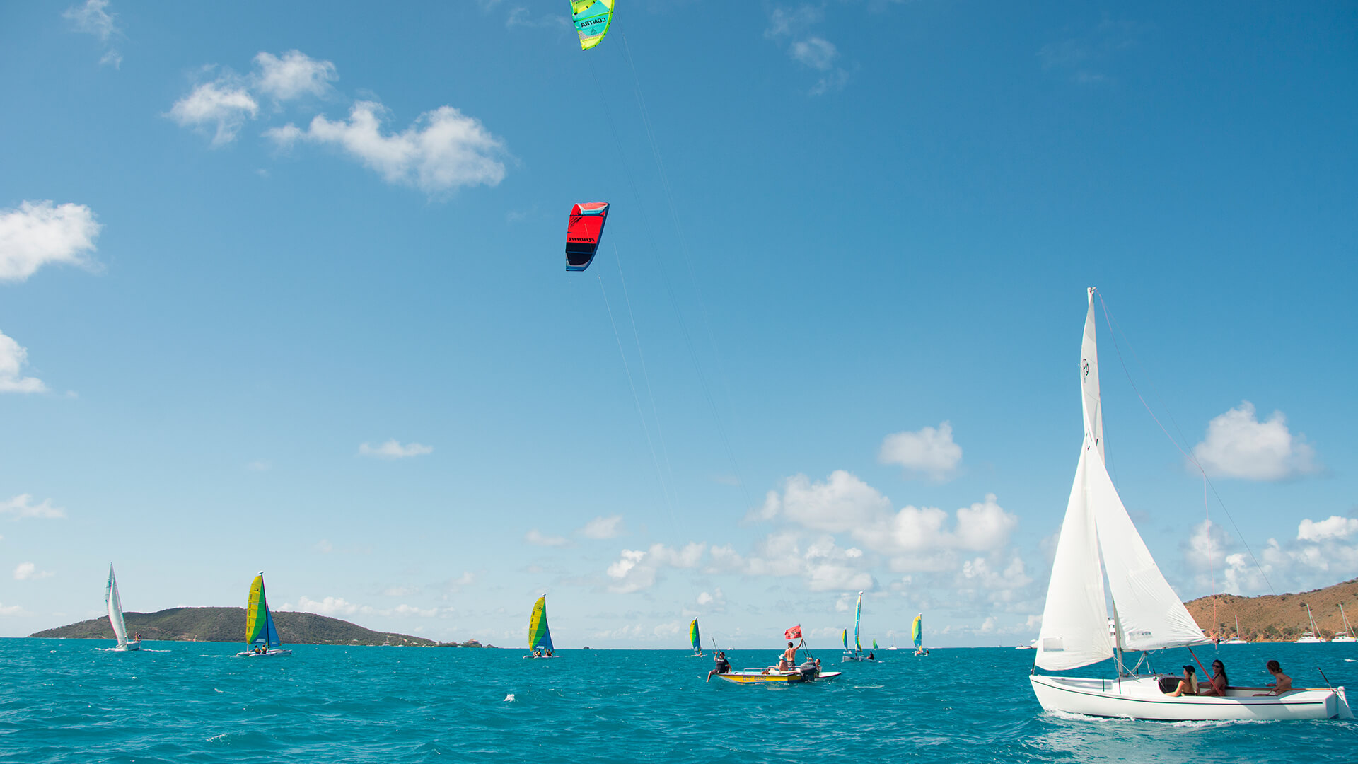 a group of people sailing on the water