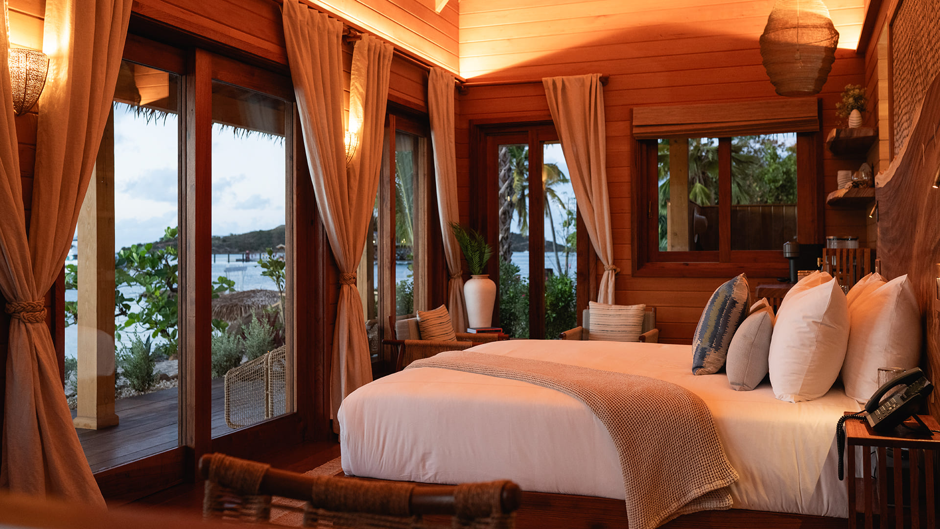 a room with a bed and windows
