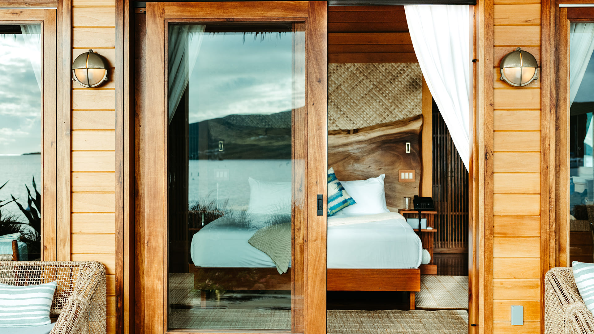 a glass door to a bed