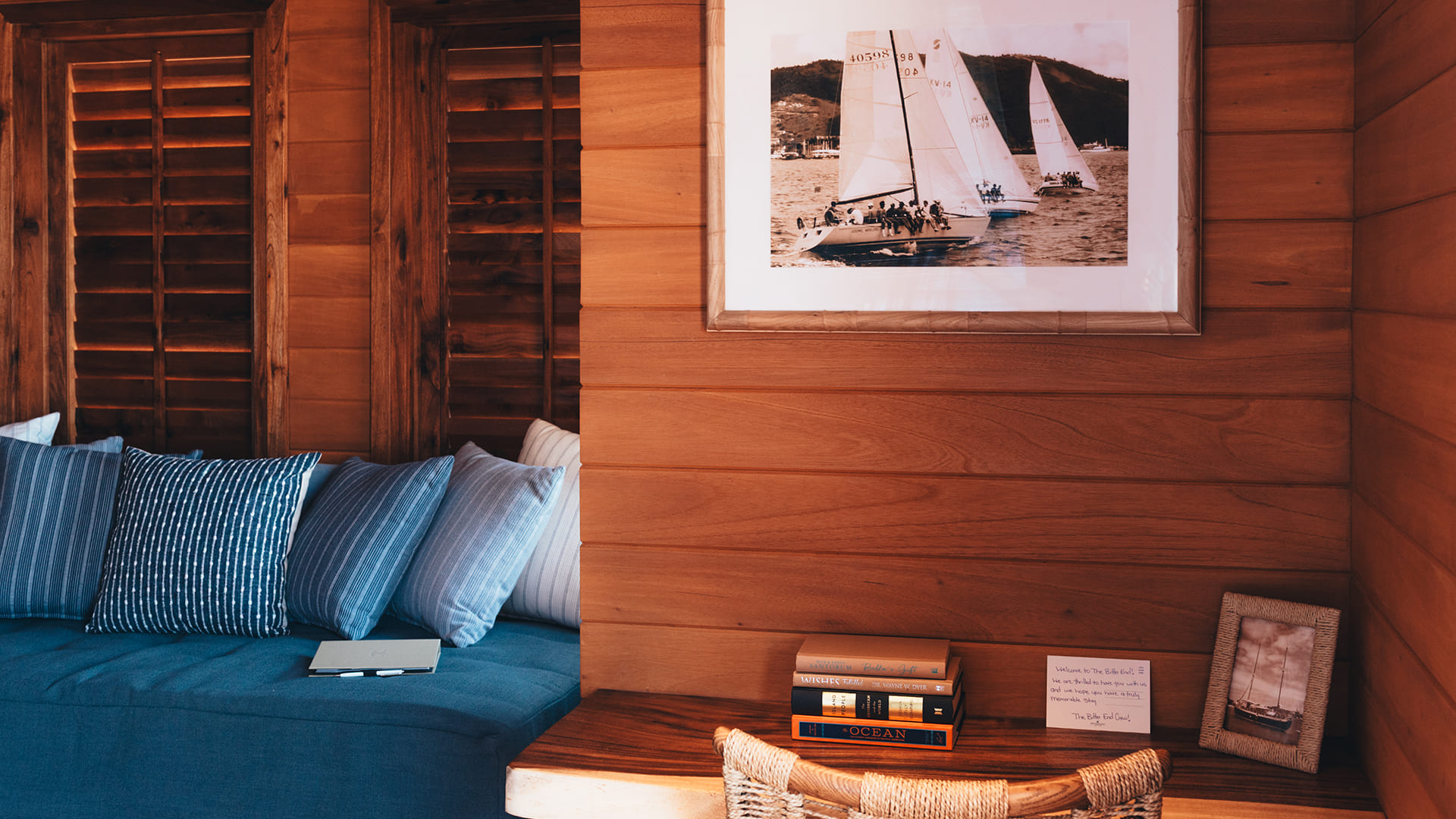 a room with a couch and a picture on the wall