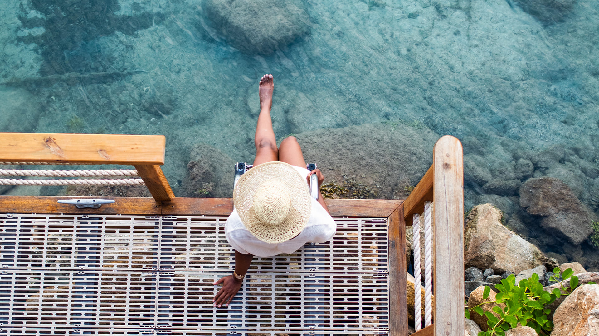 a woman sitting on a dock