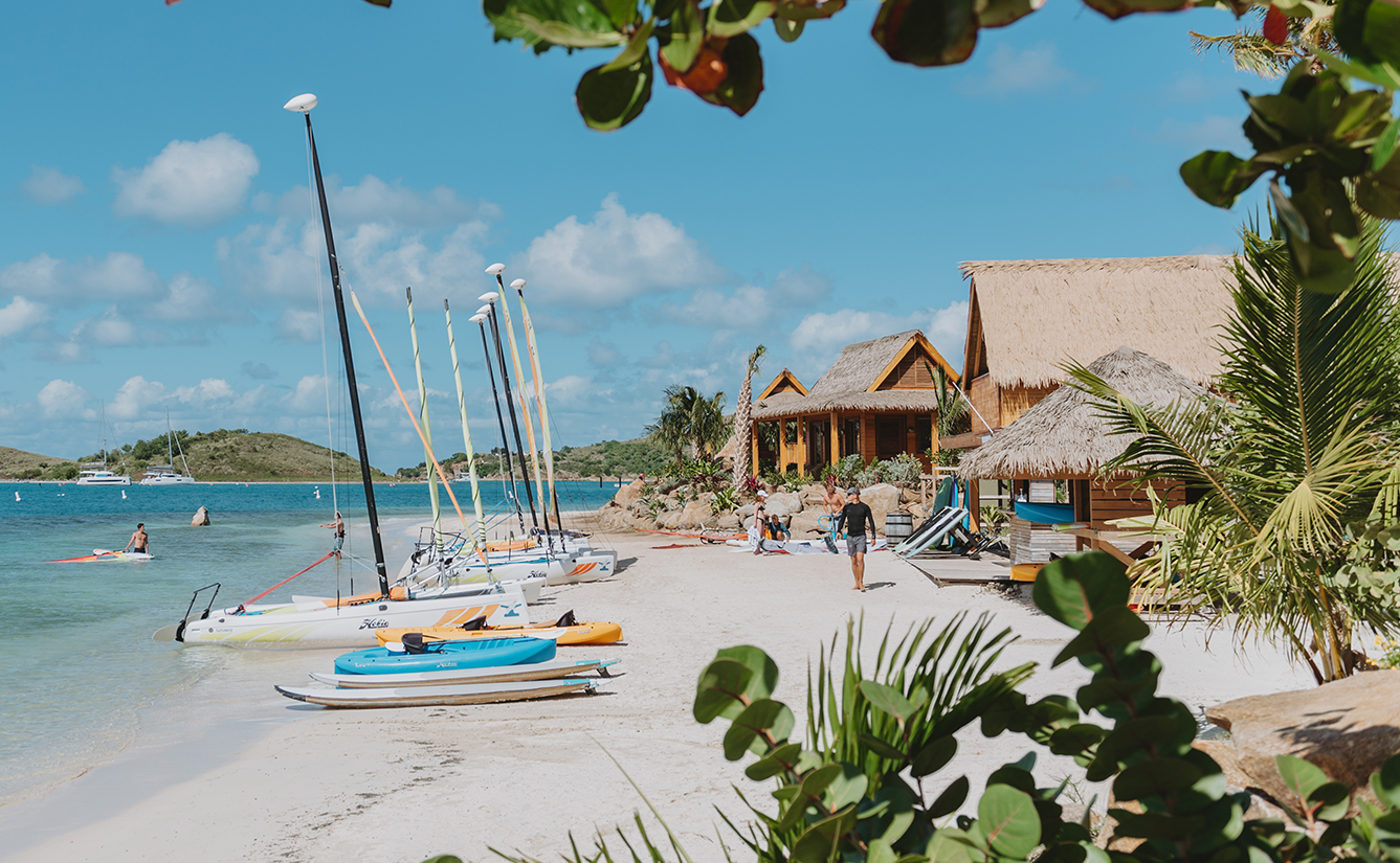 a group of boats on a beach