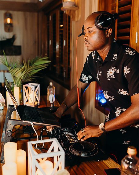 a man wearing headphones and a laptop