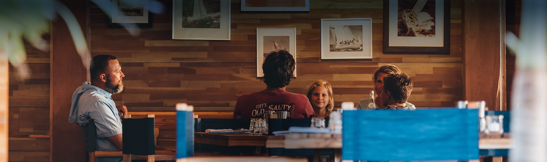 a man and a girl sitting at a table