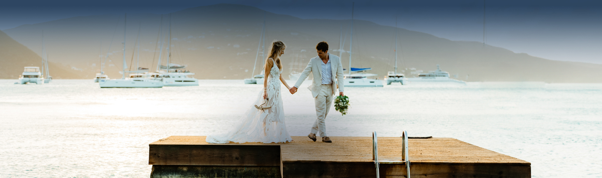 a man and woman holding hands and walking on a dock