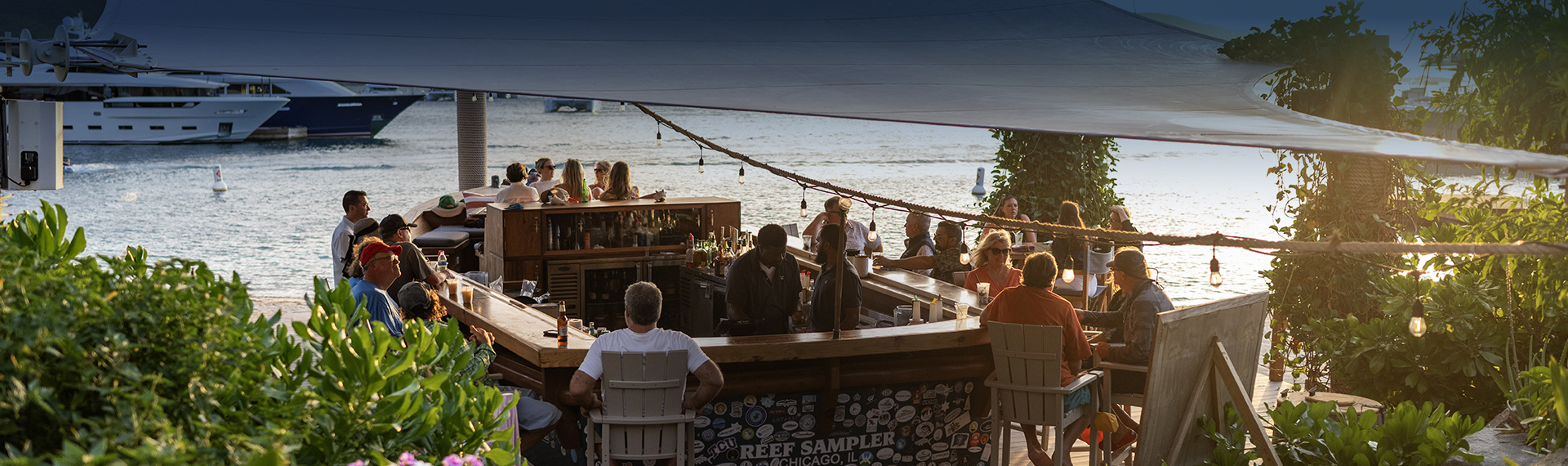 a group of people sitting at a bar