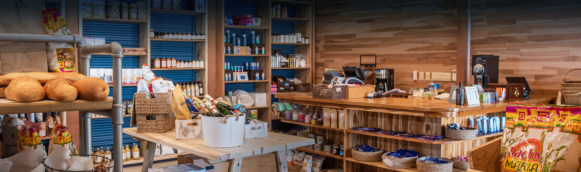 a store with shelves and a basket of wine