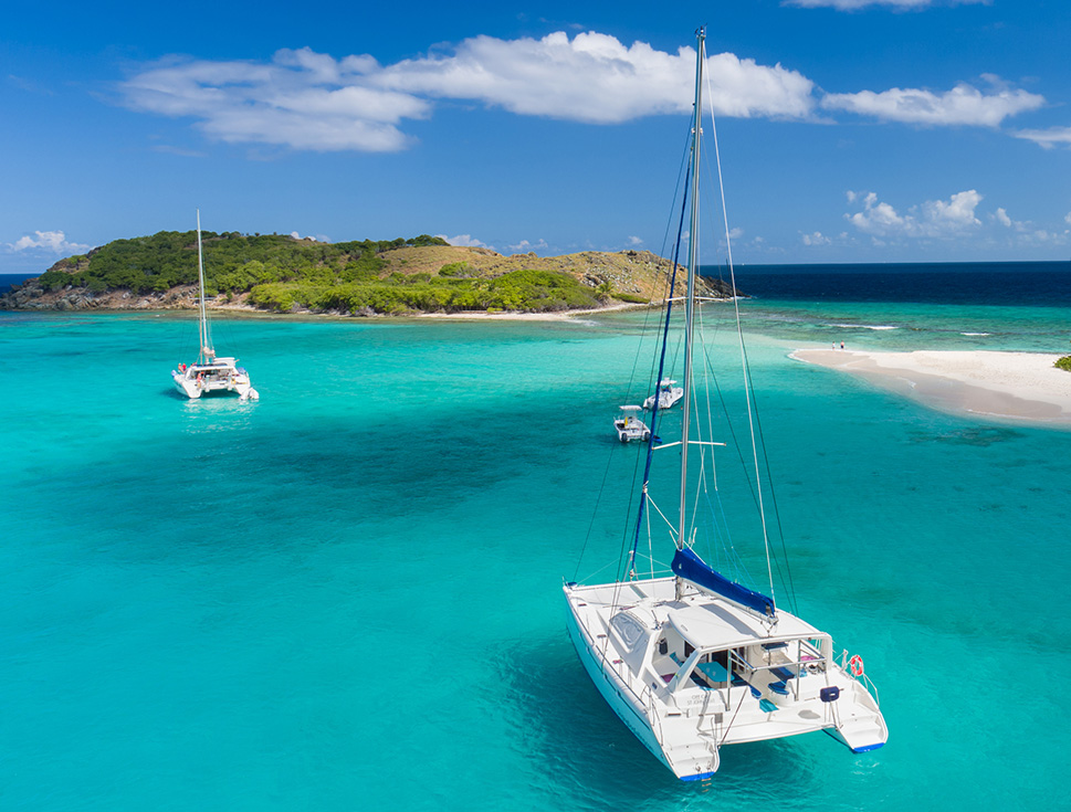 a group of boats in blue water