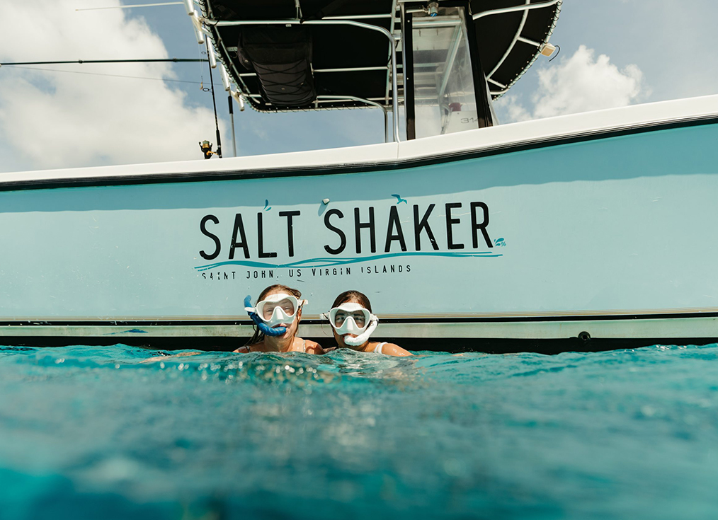 two people in the water with snorkeling gear