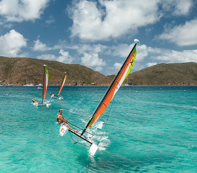 a group of people sailing in the water